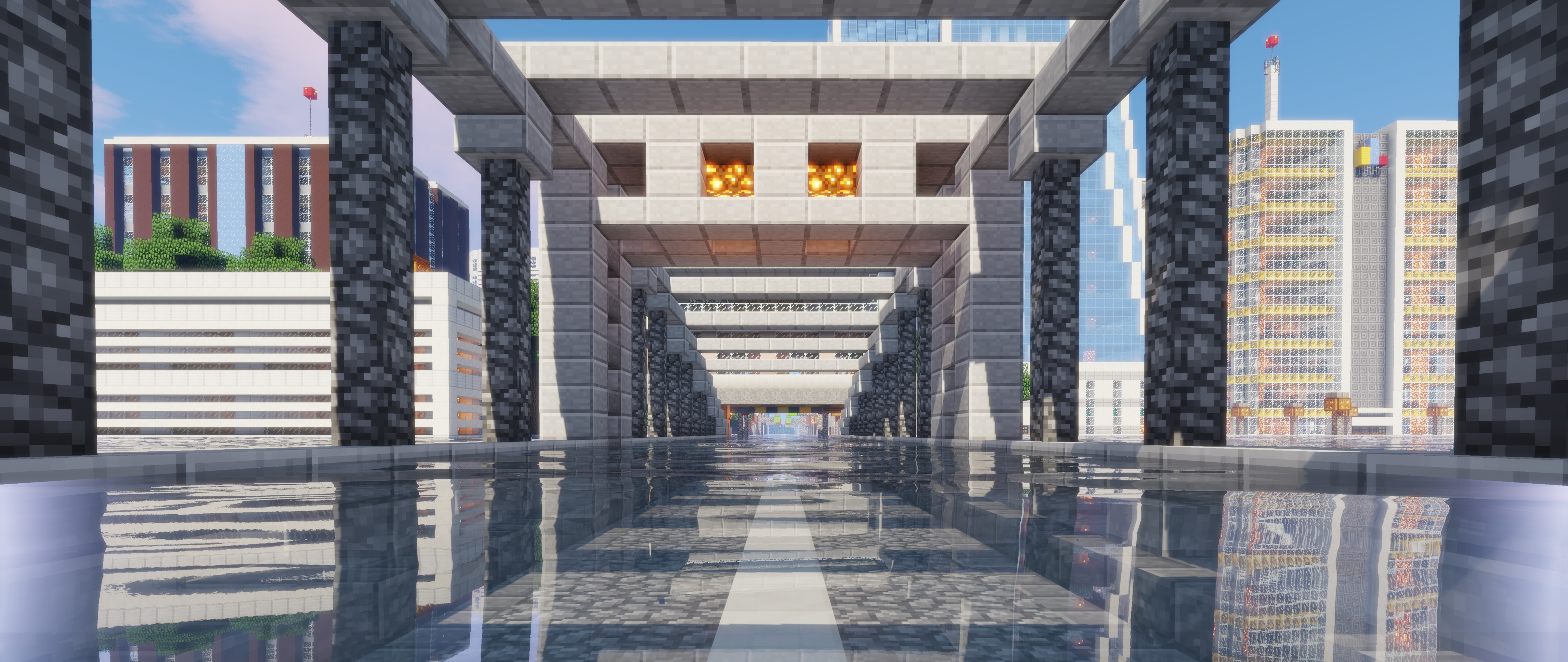 Персонаж Стів із гри Minecraft стоїть на тлі мальовничого ландшафту, що складається з кубічних блоків, і гори видніються на горизонті.